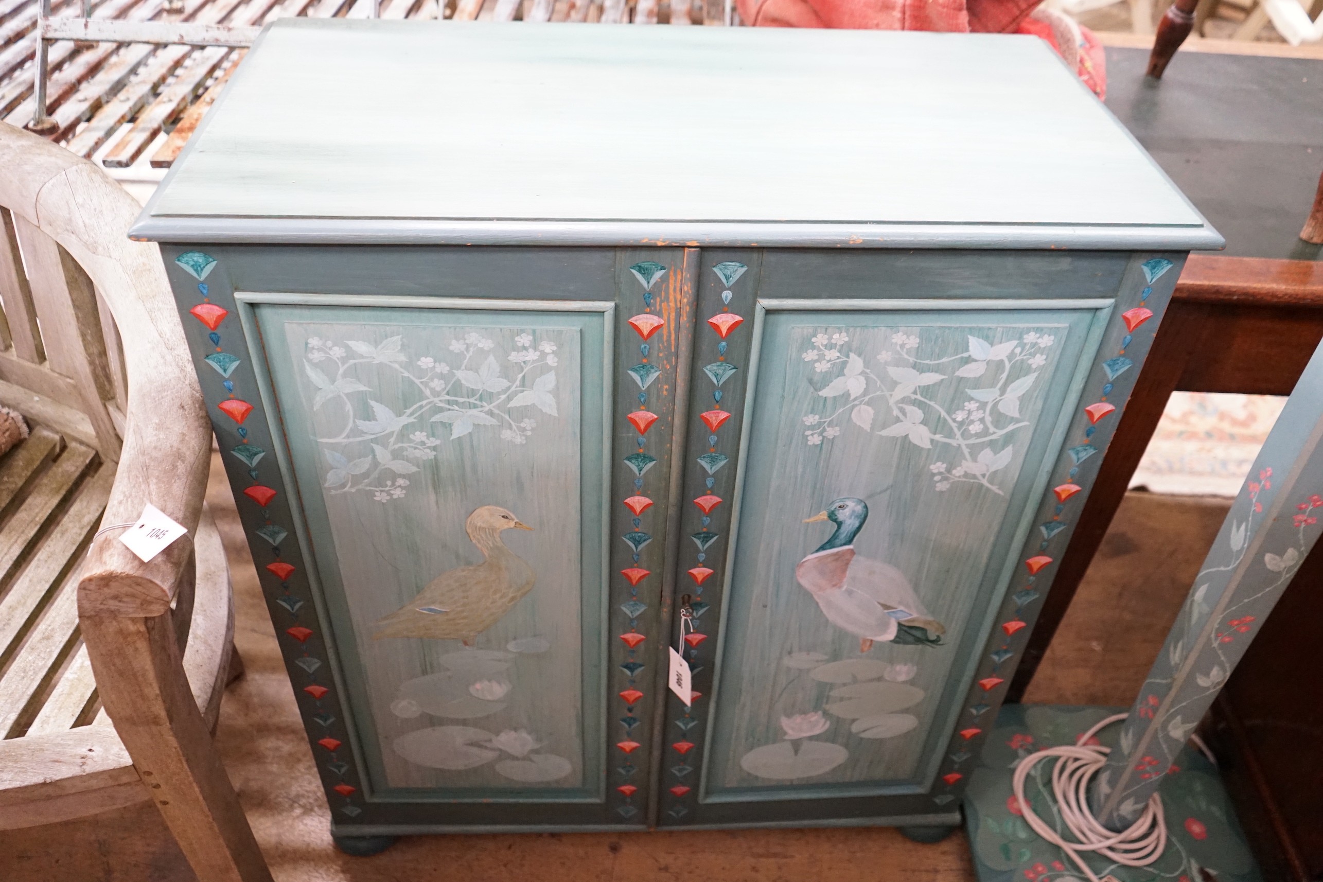 A painted pine two door cabinet, width 84cm, depth 43cm, height 93cm and matching floor lamp